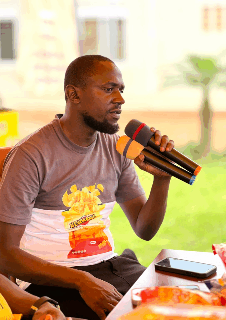 A close up shot of Katende Uthman, Newman's Marketing Manager